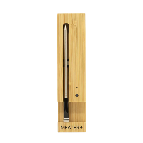 MEATER Plus wireless smart meat thermometer in wooden charging dock for precise cooking results