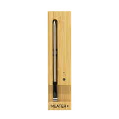 MEATER Plus wireless smart meat thermometer in wooden charging dock for precise cooking results