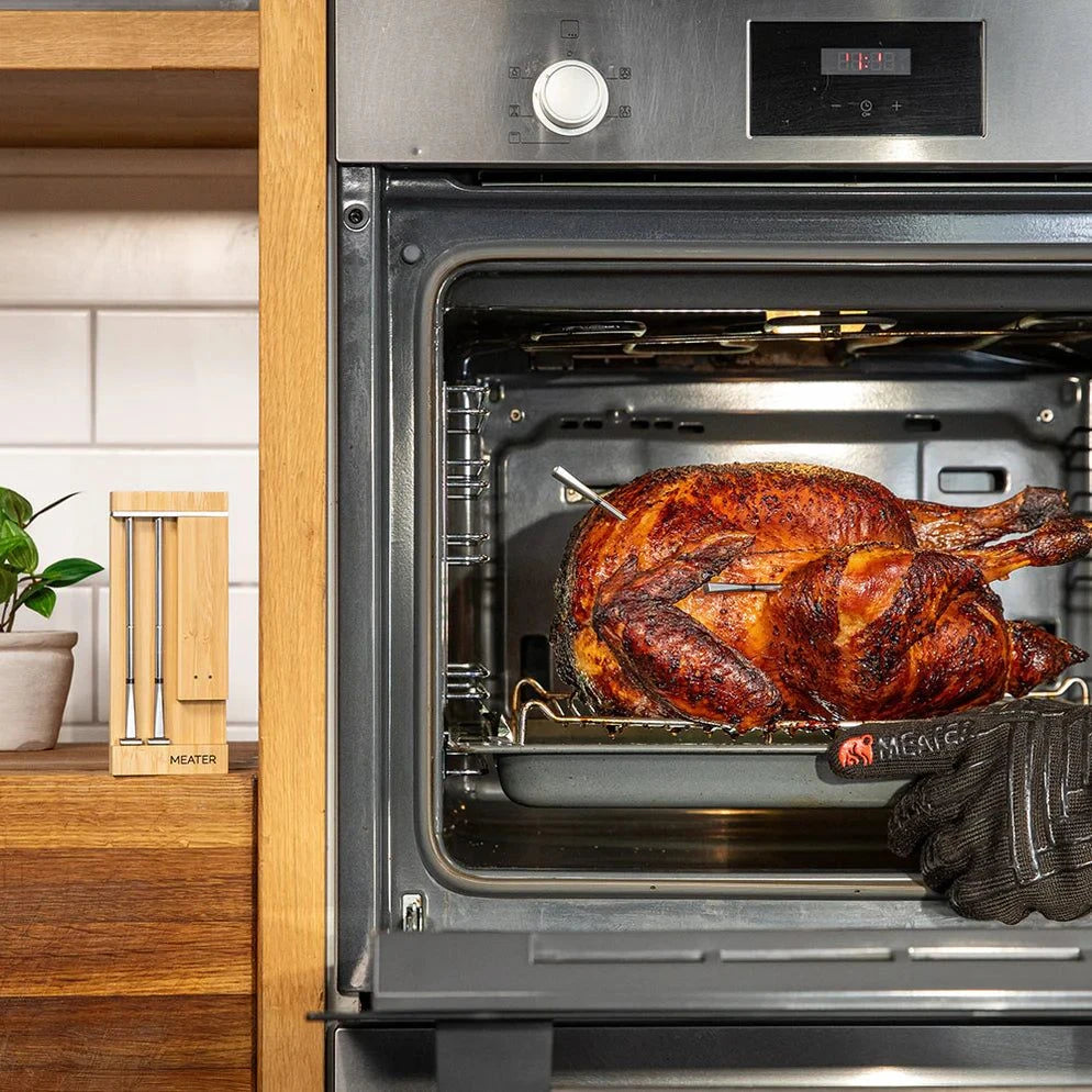 Roasted turkey in an open oven with a kitchen setting using meater